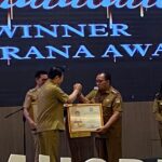 Hadiri RPJMD Sulut, Bupati RD Terima Penghargaan Paritrana Award